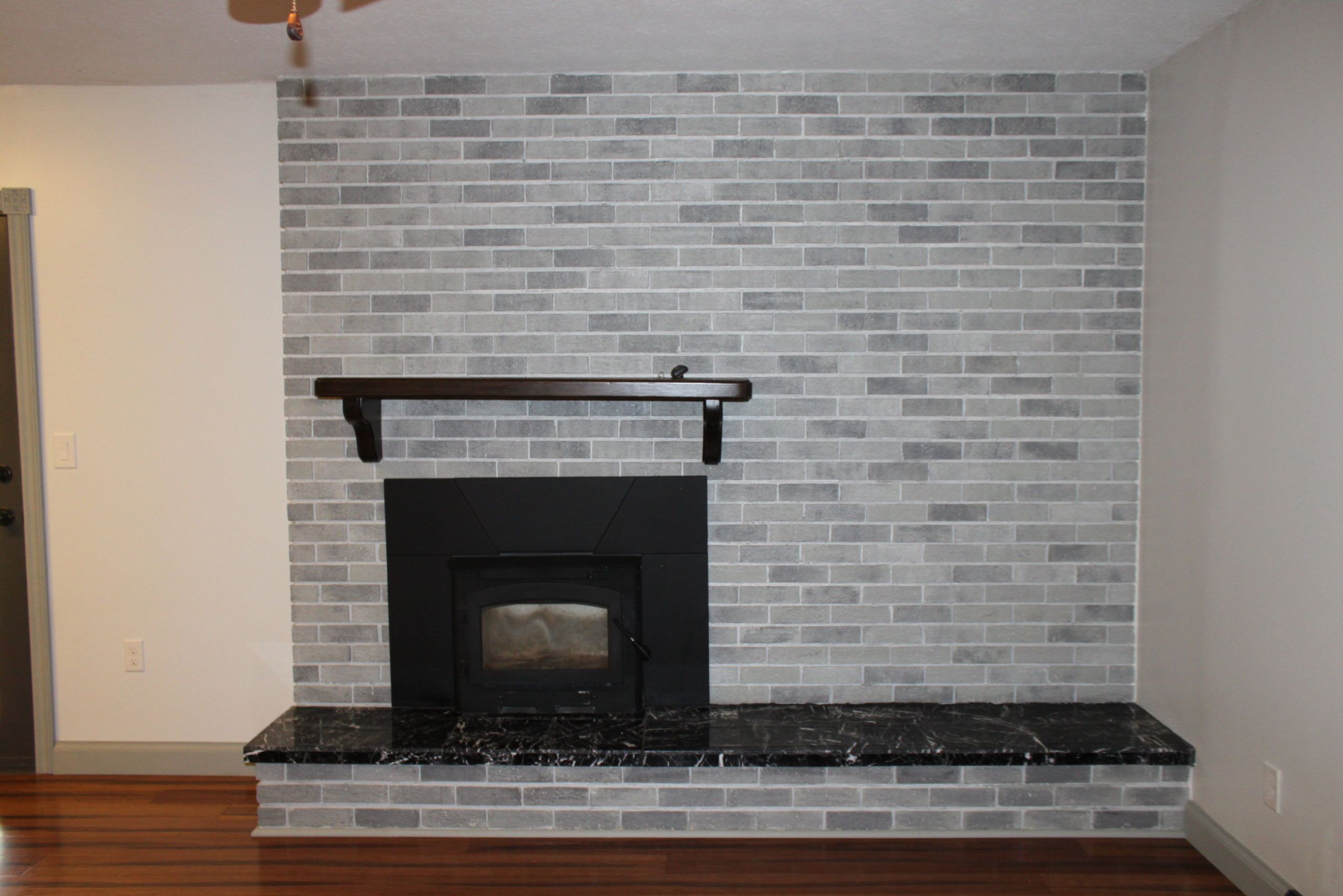 How to Update a Boring Painted Brick Fireplace - A Mom and Her Joys